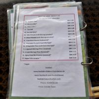 Back cover (with mostly small dishes/desserts).  Note that vegan items have a star. at Baobab House in Cape Coast