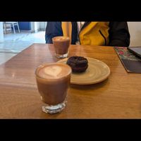 Almond milk and lovely coffee with vegan chocolate donut at Colo Coffee Andes in Bogota