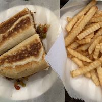 "Sausage" sandwich with fries   at Nola Mia in New Orleans