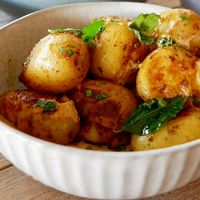 Smashed potatoes with curry mayo   at Otto Champagneria & Beer Hall in Wellington