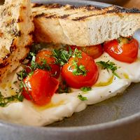 Whipped feta with roasted tomatoes   at Otto Champagneria & Beer Hall in Wellington