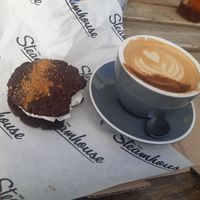 Dirty Chai Latte and vegan biscoff cookie sandwich at The Steamhouse in Redditch
