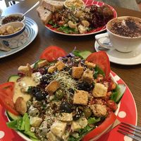 Best vegan food in town! Nearest is the large salad and furthest is the falafel one. Leaves, beans, pickles, olives , seeds (optional) potato salad , coleslaw. They vary it too!  at Toucan Cafe in Minehead