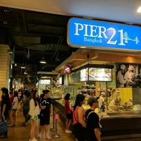 Standing next to the london bridge, facing toward the cashier stand. The vegetarian stall can be seen, one row back on the right in the center of this photo. at BKK - Veg Stall Food Court - T21 in Bangkok