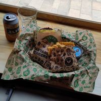 A meal with a burger, fries and no-chicken nuggets + aioli and soda at Bastard Burgers in Helsinki