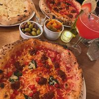 Vegan garlic bread 
Vegan pizza topped with vegan nduja and sweet peppers at Pizzeria La Gaby in Buxton