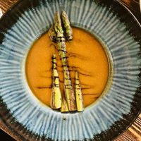 Paprika soup with balsamic cream and asparagus  at Garzon Café  in Budapest