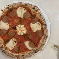 Vegan pepperoni pizzaa  at Unicorn Noms in Janabiyah