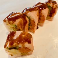 Close up of the Green Garden sushi roll with pink soy wrap.  at Mai Noodle House in Gettysburg