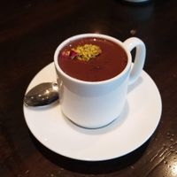 Buddha liquid truffle with pistachio rose garnish. at French Broad Chocolate Lounge in Asheville