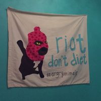 local art on walls at Kafe 44 in Stockholm