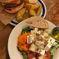 salad of the day with bread, and a burger  at Kafe 44 in Stockholm