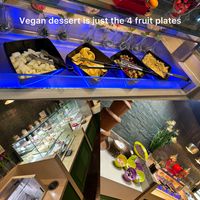 Dessert, orange slice, tinned pineapple, melon and grapes   at Panda Mami in York