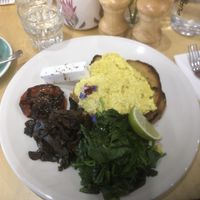 Vegan scrambled eggs (tofu) with tomato, spinach, mushroom and vegan feta   at Gellibrand Cafe in Reservoir