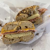 Egg, bacon, and cheese bagel sandwich on everything bagel—was super delicious and cozy!  at Ben & Esther's Vegan Jewish Deli in Seattle