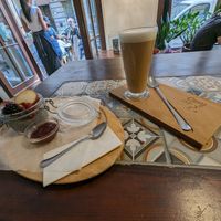 Chia pudding and an oat milk latte at Cosy Café in Budapest