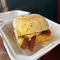 Sausage Egg Biscuit (I asked to omit cheese but the biscuit is made with cheese). I added bacon    at Soulshine Vegan Cafe in Indianapolis