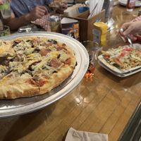 Vegan sausage pizza and vegan chili fries  at Bunzy's & Booze in Colorado Springs