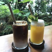 Iced latte with oat milk. And a pineapple juice  at Over the Moon Cafe in Sanur