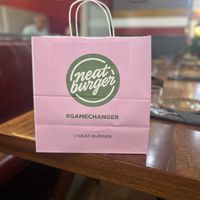 cute bags for to-go food  at Neat Burger - Dubai Mall in Dubai