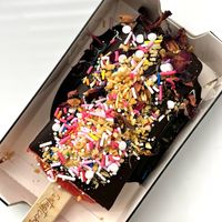 Strawberry pop with chocolate dip and sprinkles!   at Fantasticks - One Loudon in Ashburn