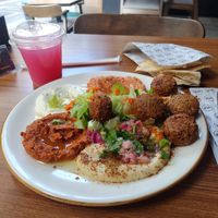 Falafel plate (white meze is yoğurt) and turşu suyu drink at Nohut Falafel Humus in Istanbul