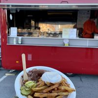 Best vegan sausages (Bratwurst) with curry sauce und fries.   at M&M Curry 510 in Tampere