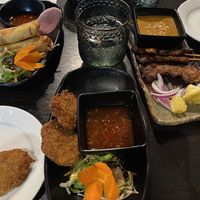 Cabbage rolls (centre), spring rolls (left), lions mane satay skewers (right)  at Soul Vegan in Edinburgh
