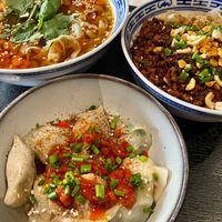 Soup with rice noodles, Dan-Dan style noodles, and Sichuan dumplings at Kaschemme in Nuremberg