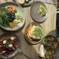 Whole cauliflower was SENSATIONAL. Mediterranean salad on the left, mushrooms and lentils on the right, with a sprouts serving too   at Honest Greens - Avenida in Lisbon