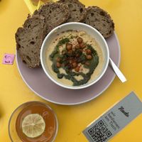 Delicious hummus with bread!   at Nude Zurich in Zurich