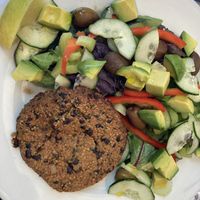Homemade vegan burger with salad  at Punto País  in Santiago