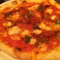 Pizza with rice milk mozzarella, capers, basil and chilli at  Al Circo Ristorante Italiano in Gran Canaria