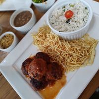Vegan meatballs with rice, beans, salad, crispy potatoes and farofa at Gazebo Café & Bistrô in Sao Luis