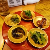 Bunch of small plates of the most incredible bites of our trip at Vegan Izakaya NIJIYA 虹屋 in Kyoto