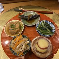 Obanzai course: deep fried tofu, braised eggplant, simmered radish strips, Japanese mustard spinach with sesame, and candied sweet potato.   at Vegan Izakaya NIJIYA 虹屋 in Kyoto