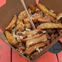 Chips with garlic and rosemary seasoning, sweet chilli sauce and cheese. at The Hippy Chippy in Bristol