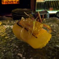 11 - Apple & Cheddar - 
Braised Apple, Glazed Onion, Cheese Crisp, Chives, Maple Thyme Shoyu
 at Omakaseed in New York City