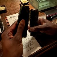 Fancy mini sushi burrito for one of the courses   at Omakaseed in New York City