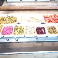 Salad bar and fruit at Sen Việt Vegan Restaurant in Helsinki