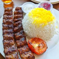 Plant based koobide kebab with saffron rice and grilled tomato at Celeshmet in Vancouver