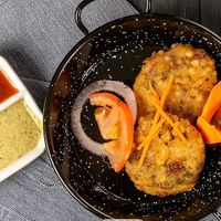 Onion pakora/ onion bhaji 
Vegan  at The Klay Oven Restaurant in Teneriffe