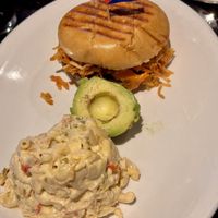 Vegan burger with Hash potato, salade and avocado sides.  at Chicas Cuban Cafe in Deland