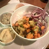 Delicious and fresh veggie bowl with hummus and baba ganoush on the side   at Casa Abierta in Leon