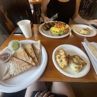Vegan jackfruit quesadilla (bottom left), vegan spinach empanada & vegan corn empanada (bottom right), vegetarian spinach empanada (up right), vegetarian avocado toast (up left)  at Dark & Light Cafe in Mount Dora