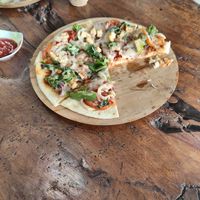 Dairy cheese (non vegan) in vegan pizza and Mexican wrap. at Pondok Murini in Ubud
