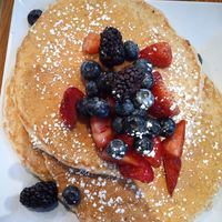 Very vegan pancakes topped with sugar and fruit at Square Cafe in Pittsburgh