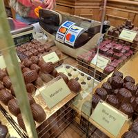 Cherry kirsch and creme vanilla (label blocked by glass but its the lion rampant one) at Chocolatier Van Oost  in Bruges