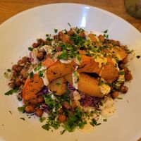 Roasted pumpkin with chickpeas and coleslaw at HAPPA Restaurant in Berlin
