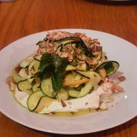 Zucchinisalat auf Labne mit Mandel-Erdnuss-Splittern at HAPPA Restaurant in Berlin